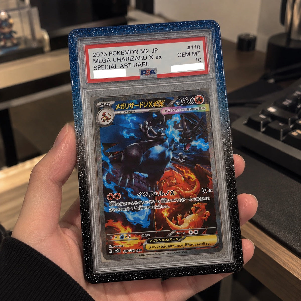 A PSA 10 Mega Charizard X slab in a GX Slab Guard